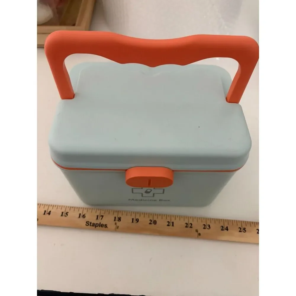 Modern portable plastic medicine box with orange handle and latch